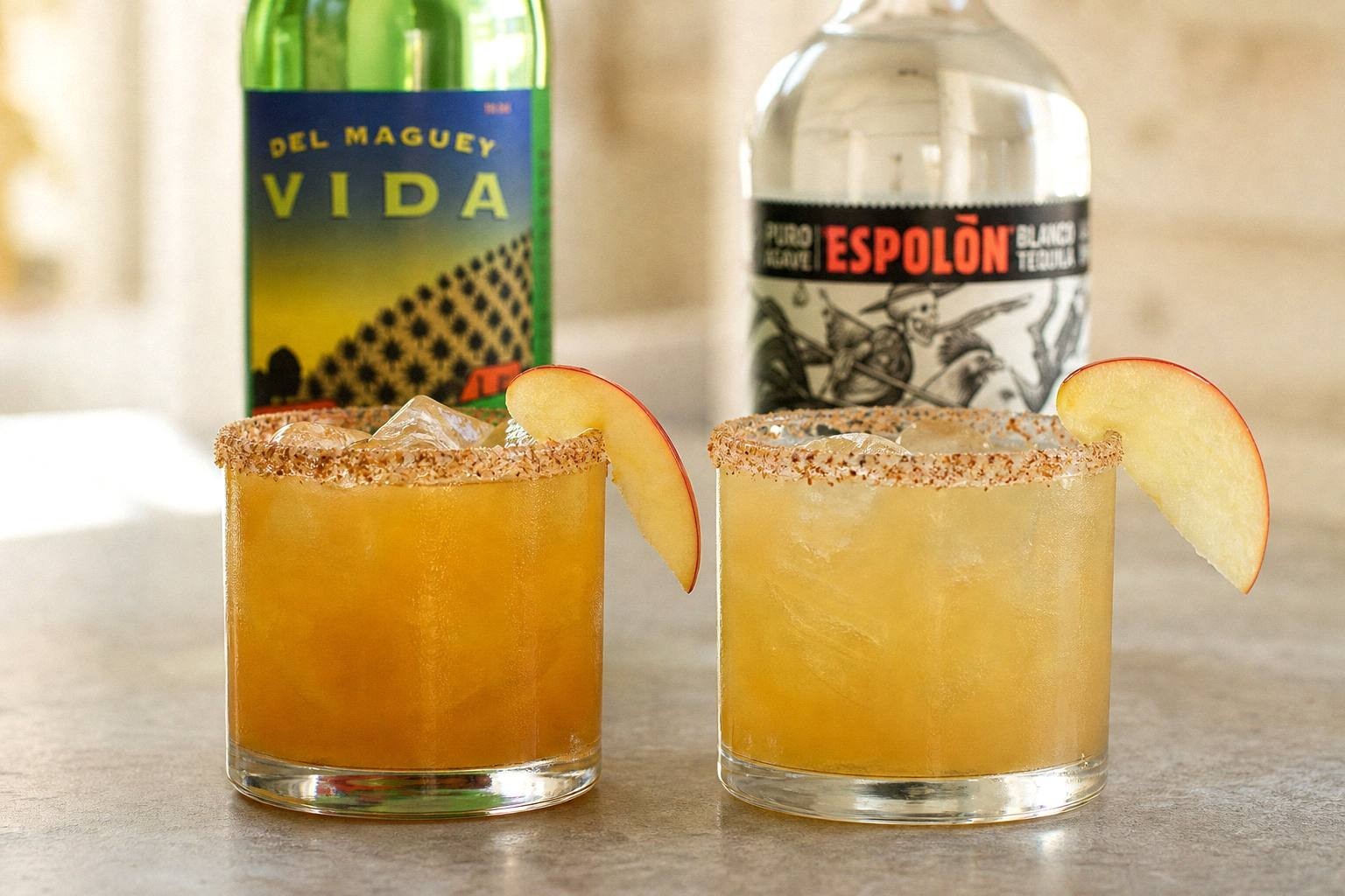 two margaritas side by side, one made with mezcal and one with silver tequila